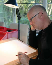 Graham S Reed at drawing board.  His workshop is on Friday 5 July